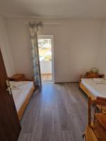 Family Room with Balcony and Garden View (2+2)