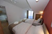 One-Bedroom Apartment with Balcony and City View