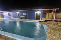 Casa piscina aquecida 400m da praia - B&B Bertioga