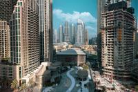 Stay in Modern Elegance 4BR with Pool Gym and Boulevard Views - B&B Dubái