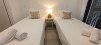 Chambre Lits Jumeaux avec Salle de Bains Commune