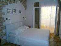 Tweepersoonskamer met Terras en Uitzicht op Zee (Begane Grond)