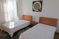 Camera Doppia con Letti Singoli e Bagno in Comune