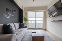 One-Bedroom Apartment with Balcony and City View