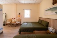 Camera Familiare con Vista Giardino