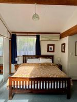 Cozy and quiet studio apartment with shared spa pool - Bed and Breakfast Dunedin