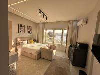 Zimmer mit Queensize-Bett und Meerblick