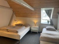 Dreibettzimmer mit Gemeinschaftsbad