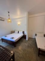 Chambre Triple - Vue sur la Piscine