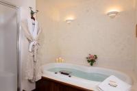 Queen Room with Jacuzzi Tub and TV and Gas Fireplace