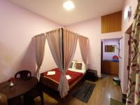 Camera Familiare con Vista Giardino