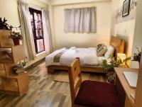 Doppel- oder Zweibettzimmer