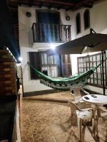Excelente casa a 40 metros da Praia e 100 m do Shopping Peró ! Suítes com ar condicionado - B&B Cabo Frio