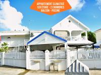 Le Sable Bleu - Évasion tropicale - Idéal Couples & Familles - PLAGE 5min - Piscine - Parking privé - Logement climatisé - Vue sur les palmiers - Restau snack familial sur place - B&B Sainte-Anne