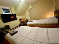 Tweepersoonskamer met 2 Aparte Bedden