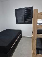apartamento martim de sá 2 dormitórios pé na areia 24 A tony - Chambres d’hôtes Caraguatatuba