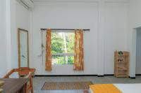 Kamer met Queensize Bed en Uitzicht op de Tuin