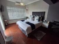 Zimmer mit Queensize-Bett und Gartenblick