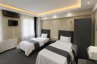 Camera Deluxe Doppia con Letti Singoli