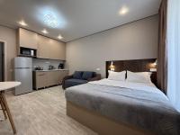 Квартира- студия Раимбек резиденс 16-1 & питьевая вода подарок - Bed and Breakfast Almaty