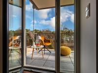 Prora - Modernes Apartment mit Balkon, Meerblick und E-Ladestation - Baltic Sunrise - B&B Ostseebad Binz