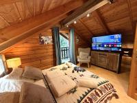 LE GRIZZLY Chalet en bois avec SPA Jacuzzi - B&B La Bresse