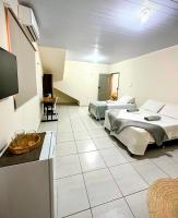 Suítes independentes em apartamento próx beira rio - B&B Barreirinhas