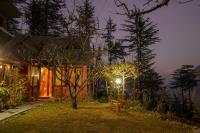 Ishan Log Huts-A boutique home stay - Chambres d’hôtes Banjār
