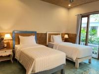 Camera Deluxe Doppia con Letti Singoli