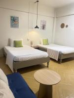 Tweepersoonskamer met 2 Aparte Bedden en een Terras