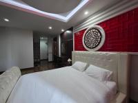 Chambre Deluxe (2 Adultes + 1 Enfant)