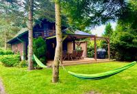 Leśny Domek Leniwiec z jacuzzi i kominkiem blisko rzeki - B&B Pogorzelec