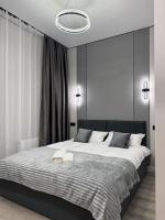 Уютная новая квартира рядом с MEGA ALMATY на Розыбакиева - Chambres d'hôtes Almaty