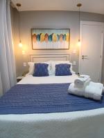 Casa c AR - condomínio prox ParkShopping Cpo Grande a 30 minutos do Recreio, c 2 TVs Smart de 50 e 43 polegadas-varanda privativa- cozinha completa e séries liberadas - CS4 - Bed and Breakfast Minduri