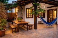 Casa charmosa em condomínio com piscina, churrasqueira e 3 banheiros a 5 min da praia em Manguinhos - Chambres d'hôtes Armação dos Búzios