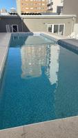 Monoambiente vista al mar y piscina - B&B Necochea