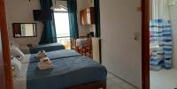 Dreibettzimmer mit Meerblick