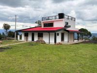 Villa El Encanto Casa campestre con fogata y vista - Chambres d'hôtes Tinjacá