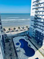 Apartamento pé na areia com 3 piscinas para família aceito pet - Chambres d’hôtes Mongaguá