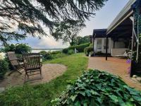 Ferienhaus erste Reihe am See mit Panoramablick und Garten - Chambres d'hôtes Scharbeutz