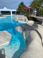 Magnifique 2 pièces avec citerne, piscine et plage Résidence MANGANAO - Chambres d'hôtes Saint-François