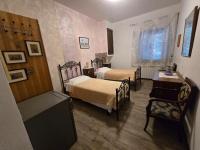 Tweepersoonskamer met 2 Aparte Bedden