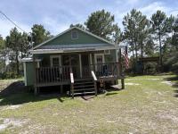 Classic coastal cottage with screened deck hammock & washer&dryer - Chambres d'hôtes Carrabelle