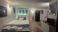 Accogliente monolocale con giardino privato - B&B Cannigione