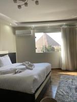Pyramids View Apartment - Bed and Breakfast Caïro