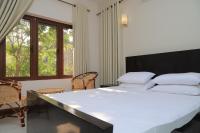 Chambre Double ou Lits Jumeaux Deluxe – Vue sur Jardin