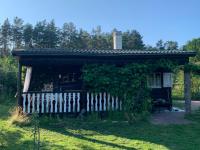 Dacza Warmińska, domek letniskowy na jeziorem - Chambres d'hôtes Sząbruk