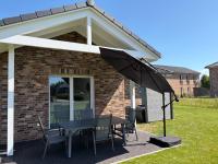 Nord und Wind Ruhiges Ferienhaus mit Wallbox, Sauna und Whirlpool 800m zur Nordsee 5 Sterne DTV - Chambres d'hôtes Büsum