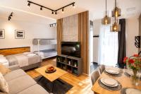 Slunné studio v centru jen 150m od lanovky, s vlastním parkováním a malou terasou, WIFI, SAT, rekuperace, vybavená kuchyně a moderní koupelna s pračkou - B&B Harrachov