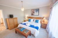 Zimmer mit Kingsize-Bett oder Zweibettzimmer mit Whirlpool-Badewanne